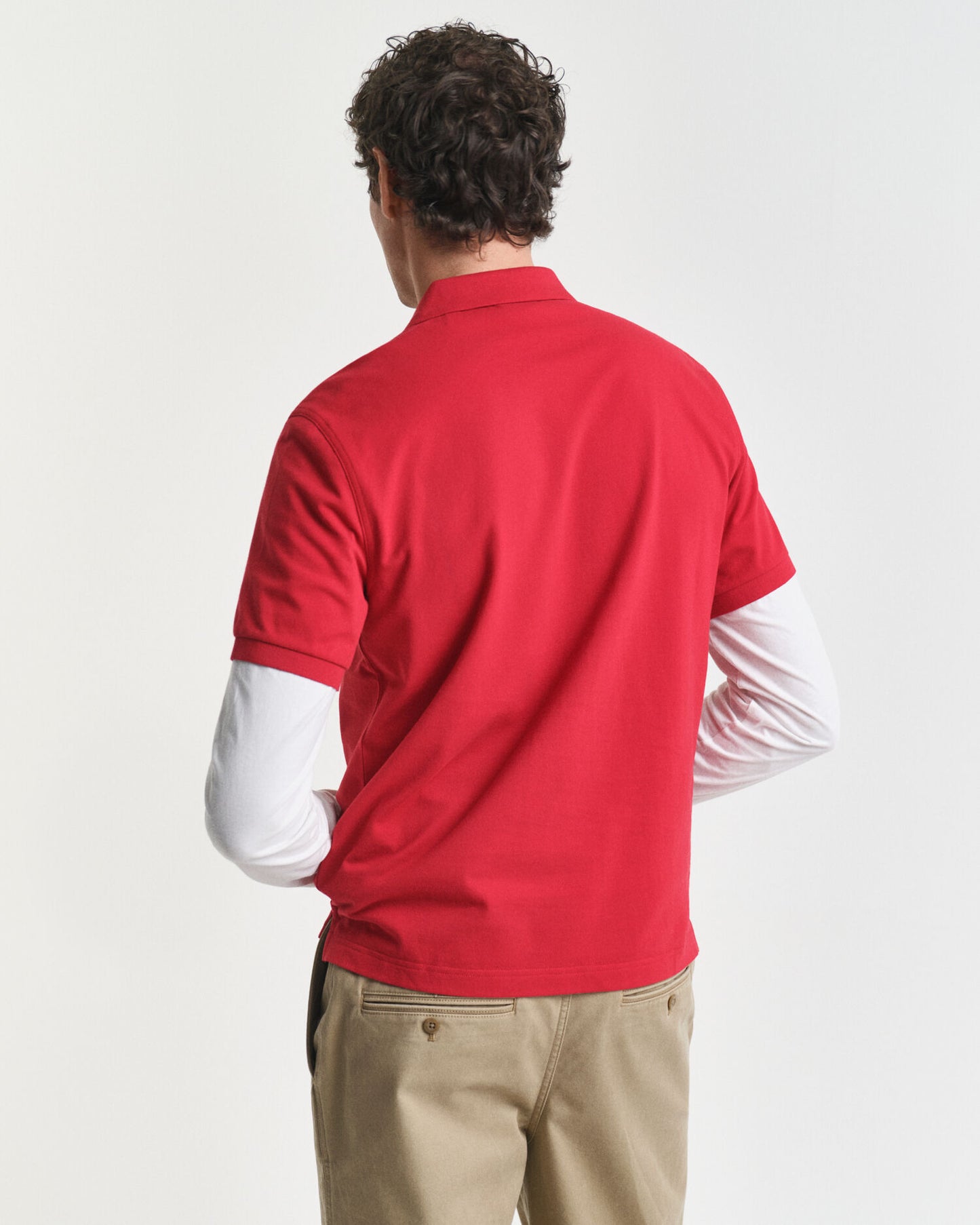 Polohemd aus Piqué mit regular fit und Wappen-Logo
